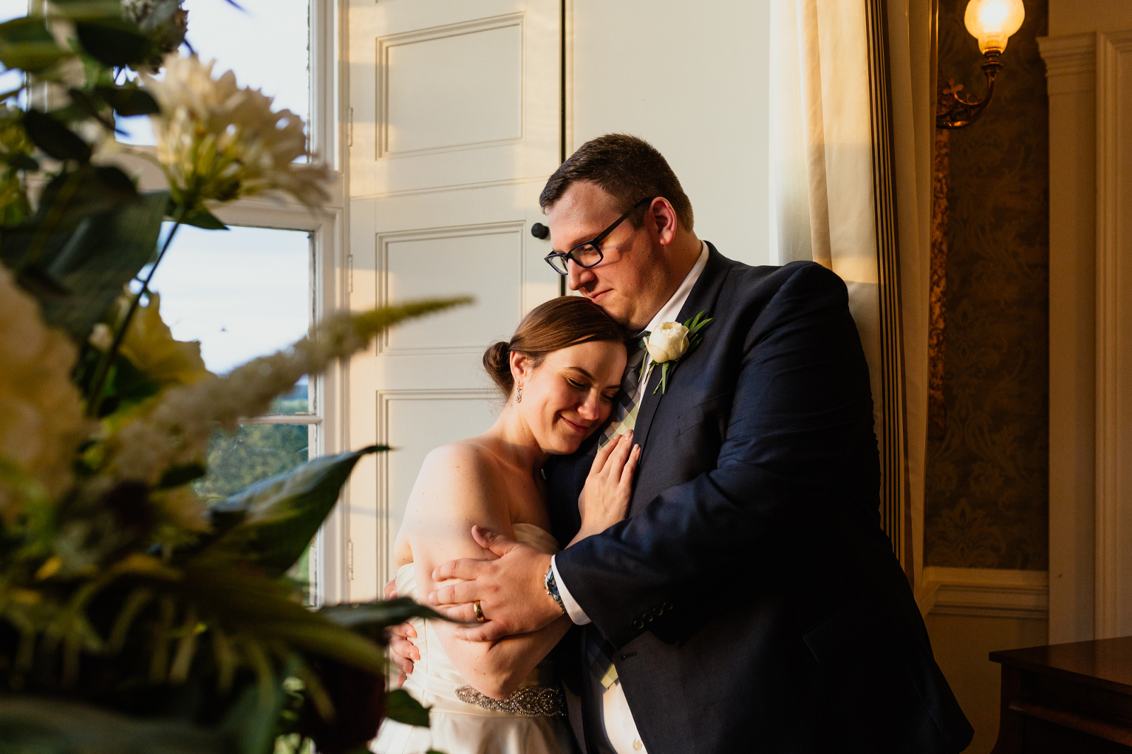 bride-groom-standing-in-golden-light-at-blairquhan-castle